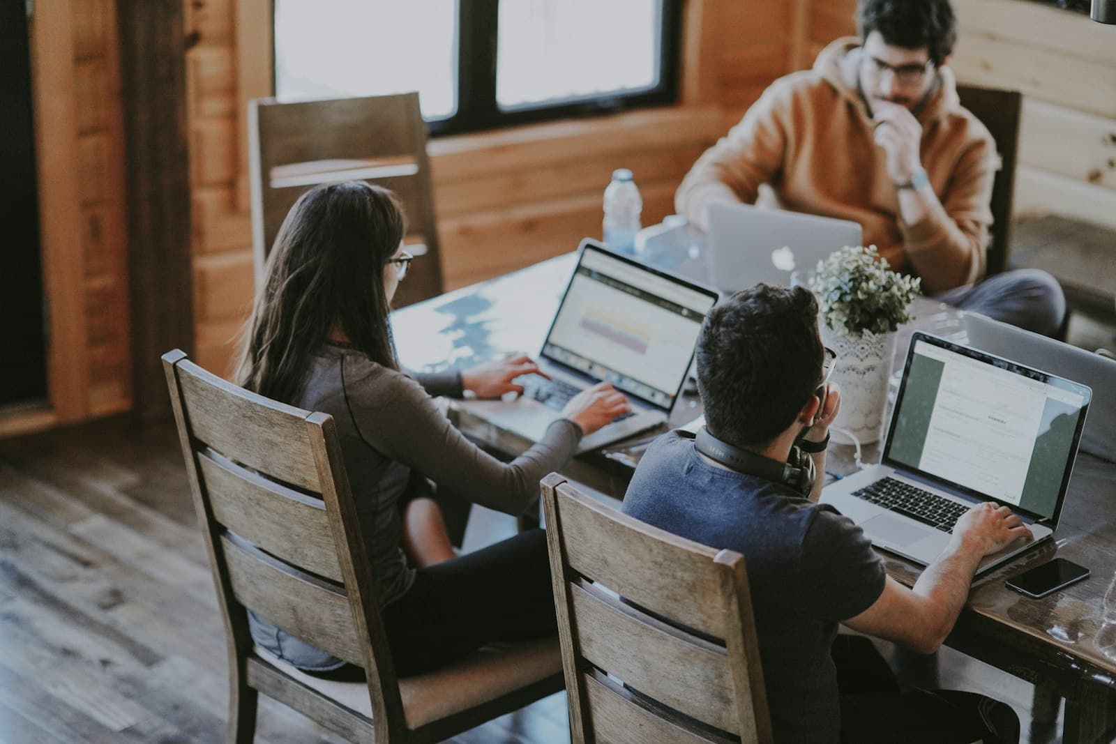 A team building software together at their laptops